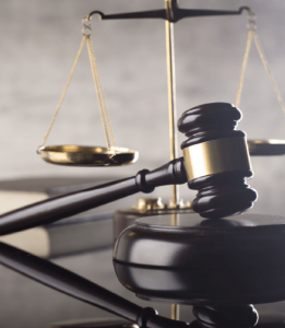 An overtime lawyer reviews legal documents in a professional office.